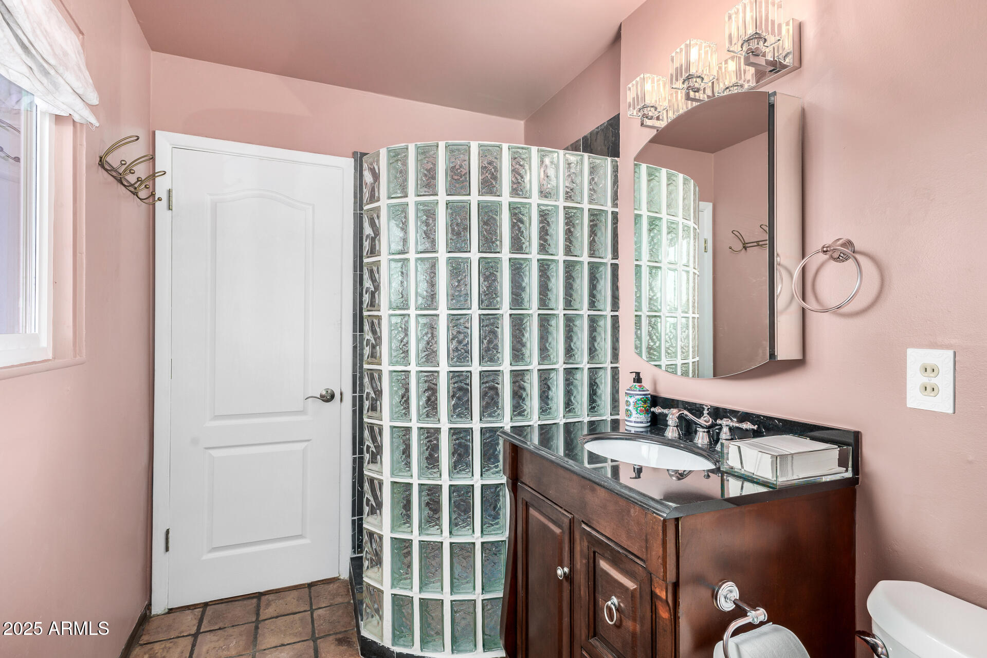 2302 West Berridge Lane Phoenix, AZ 85015 - Photo 21 of 40 a bathroom with a sink and a mirror
