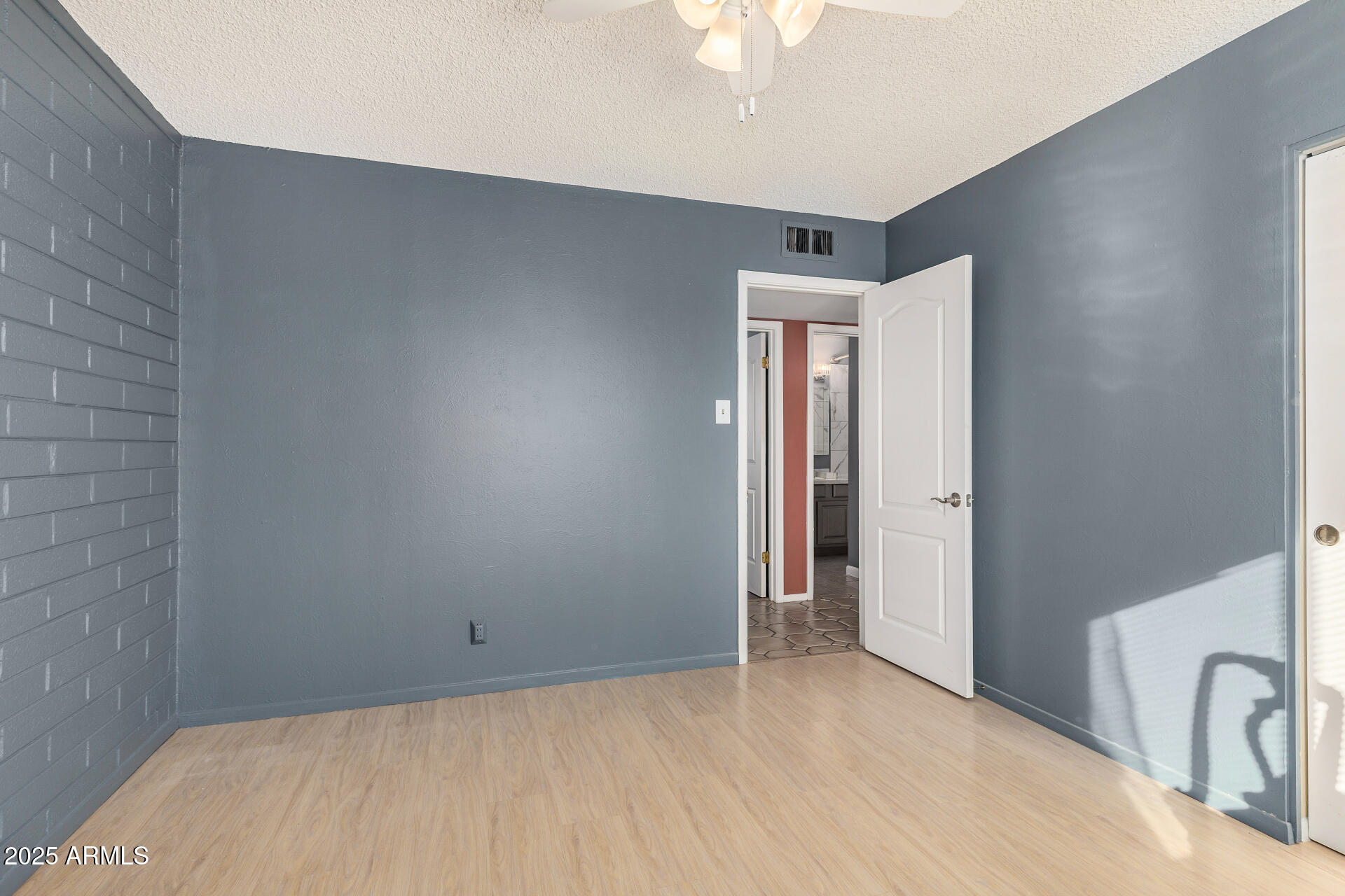 2302 West Berridge Lane Phoenix, AZ 85015 - Photo 23 of 40 a view of empty room with a ceiling fan