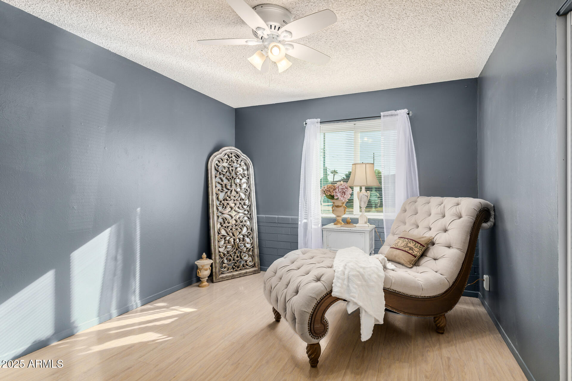 2302 West Berridge Lane Phoenix, AZ 85015 - Photo 25 of 40 a bedroom with a bed and a chandelier