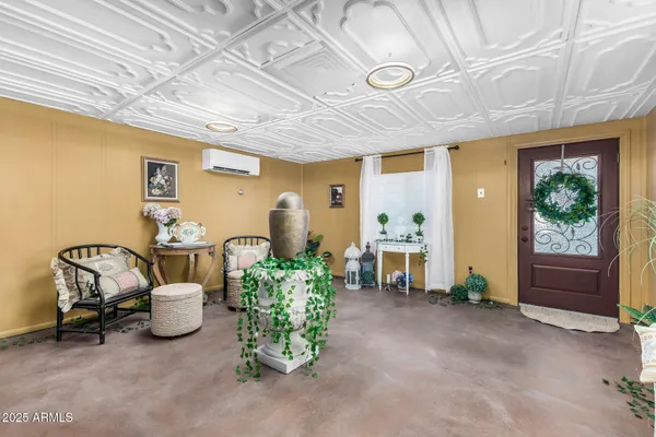 a view of a livingroom with furniture and a ceiling fan