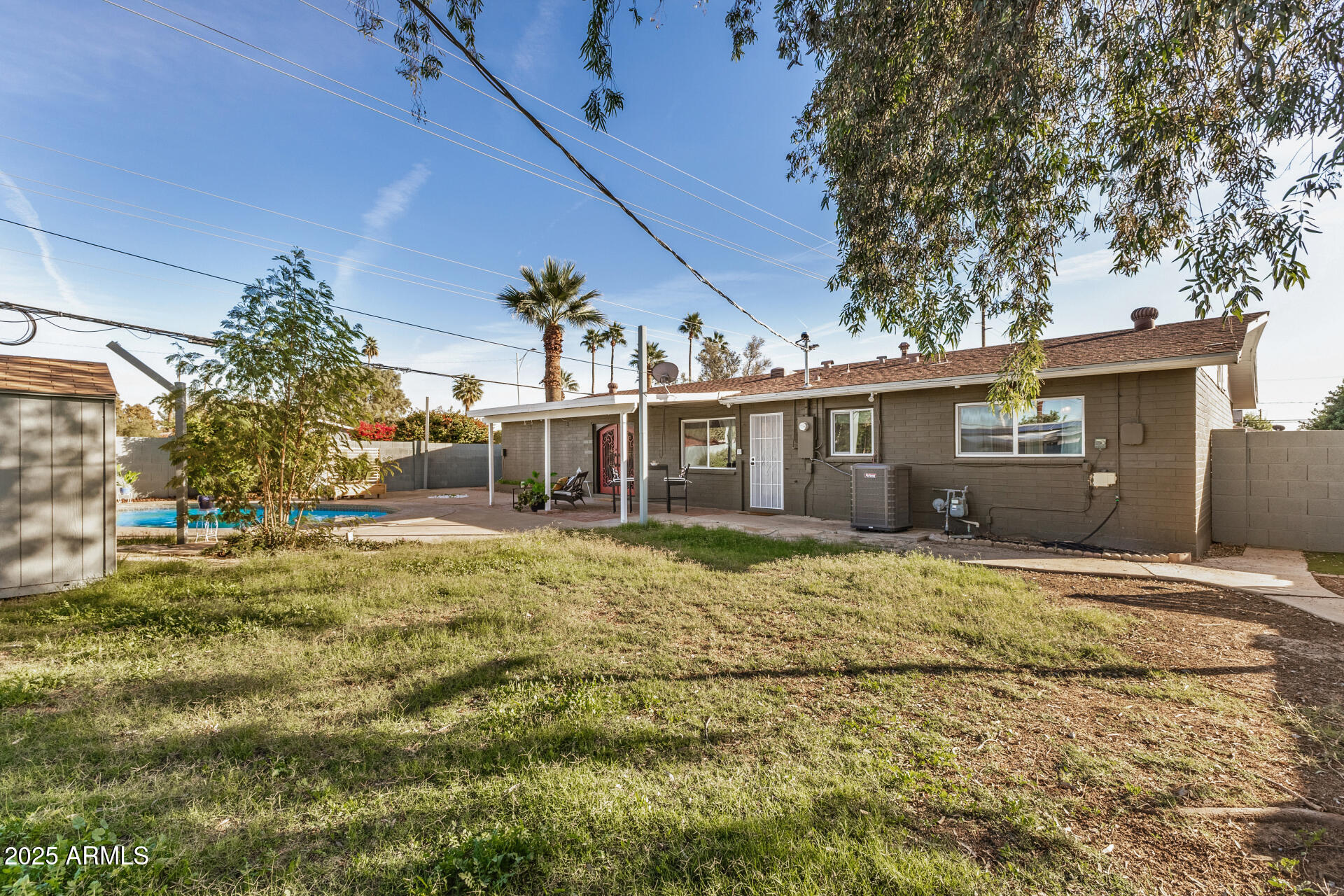 2302 West Berridge Lane Phoenix, AZ 85015 - Photo 38 of 40 a view of a house with a yard