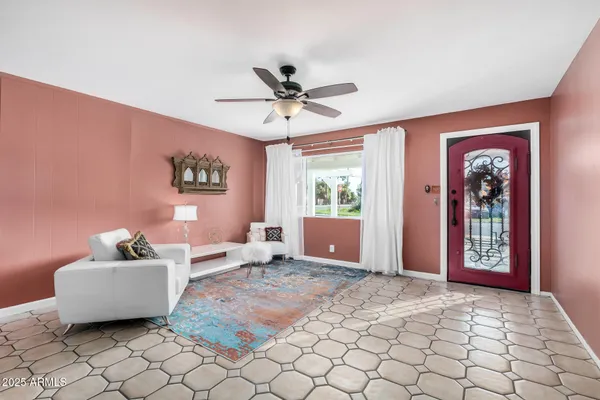 a living room with furniture and window