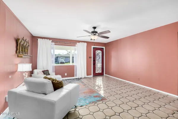 a living room with furniture and window