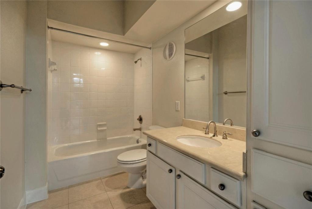 7701 Rialto Boulevard, Unit 1326 Austin, TX 78735 - Photo 10 of 11 a bathroom with a sink a toilet and shower