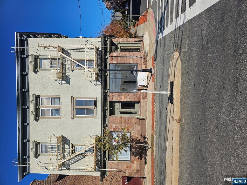 a view of a house with a street