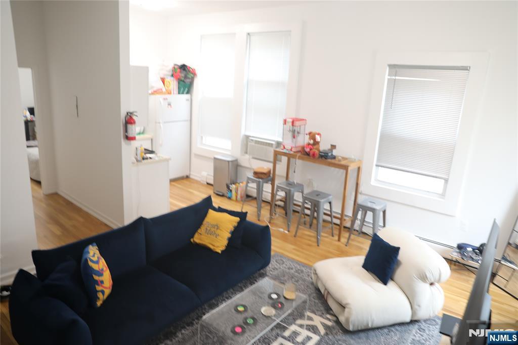 41 Glenridge Avenue, Unit 2L Montclair, NJ 07042 - Photo 3 of 6 a living room with furniture and wooden floor