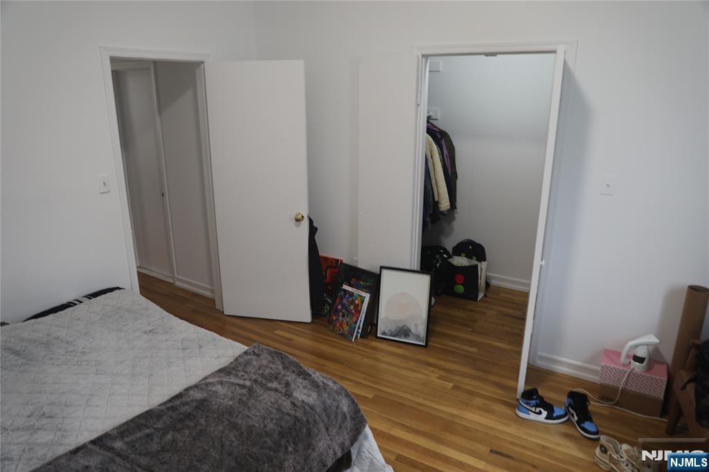 41 Glenridge Avenue, Unit 2L Montclair, NJ 07042 - Photo 6 of 6 a bedroom with a bed and wooden floor