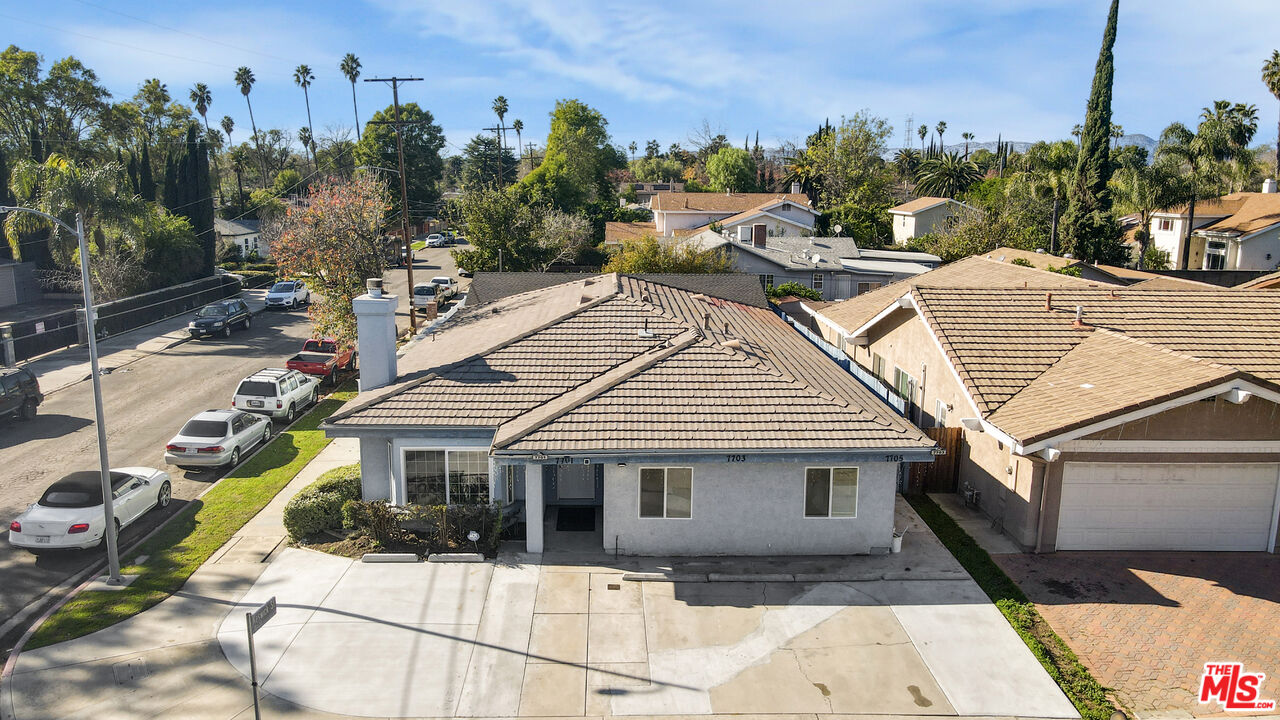 7701 Baird Avenue Reseda, CA 91335 - Photo 17 of 21 a view of a white house with a outdoor space