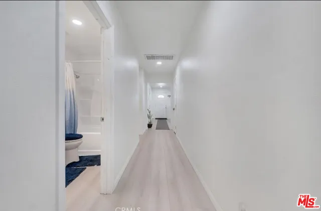 a view of a bathroom from the hallway