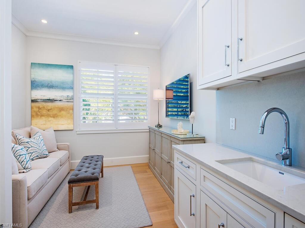 440 Springline Drive Naples, FL 34102 - Photo 16 of 28 a kitchen with a sink cabinets and window