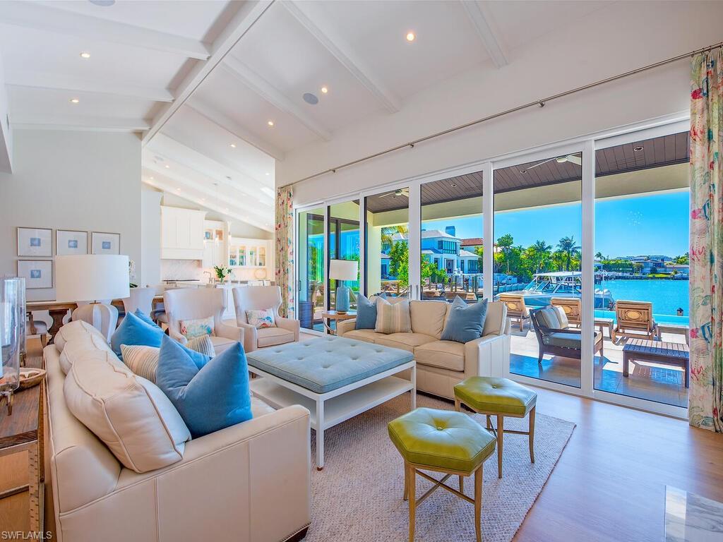 440 Springline Drive Naples, FL 34102 - Photo 6 of 28 a living room with furniture and a large window