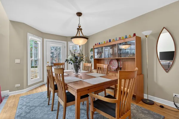 a view of a dining room with furniture and wooden floor