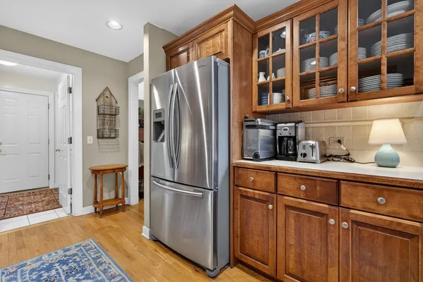 a kitchen with stainless steel appliances granite countertop a refrigerator and a sink