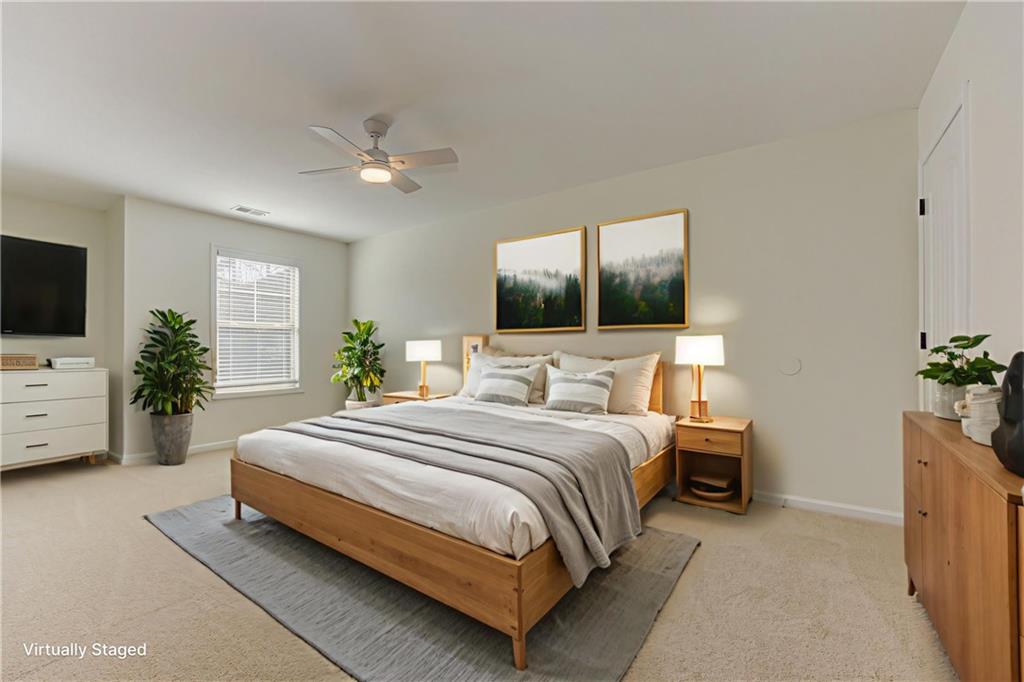 605 Summit Point Canton, GA 30114 - Photo 42 of 56 a bedroom with a bed and a flat screen tv