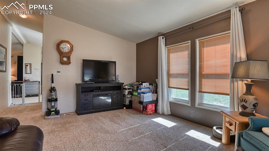 34475 East Jones Road Yoder, CO 80864 - Photo 18 of 31 a living room with furniture and a flat screen tv