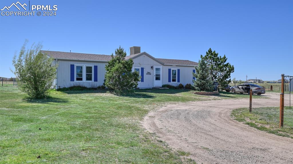 34475 East Jones Road Yoder, CO 80864 - Photo 2 of 31 a house view with a garden space