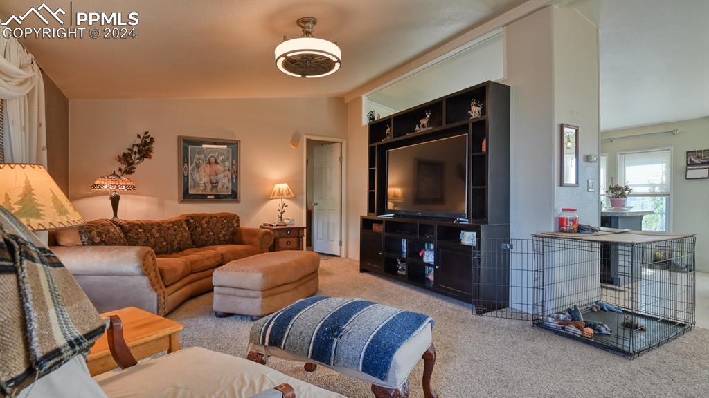 34475 East Jones Road Yoder, CO 80864 - Photo 4 of 31 a living room with furniture and a flat screen tv