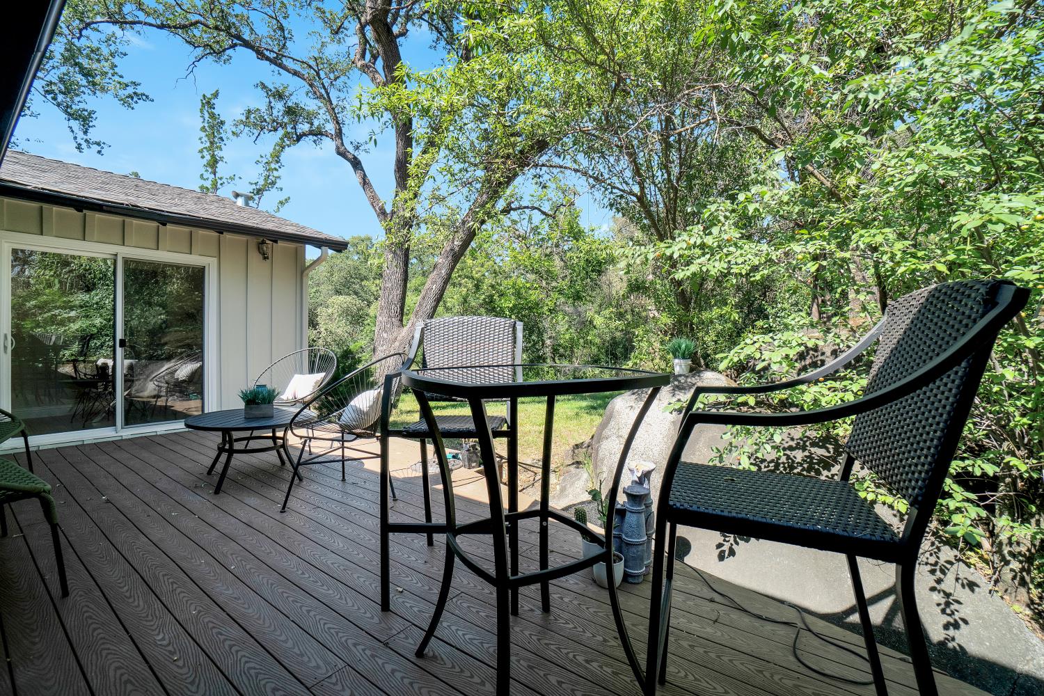 6299 Horseshoe Bar Road Loomis, CA 95650 - Photo 27 of 43 an outdoor sitting area with furniture and wooden floor