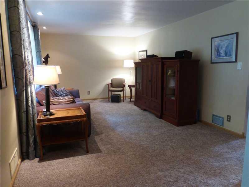 Family Room. New carpet invites you into the family room.  Giant window delivers warm natural day light.