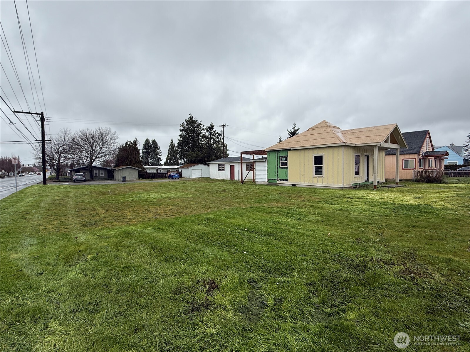 490 West Spruce Street Sequim, WA 98382 - Photo 18 of 18 a view of a house with a big yard and large trees