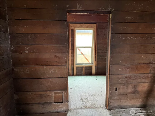 a view of an empty room with a fireplace