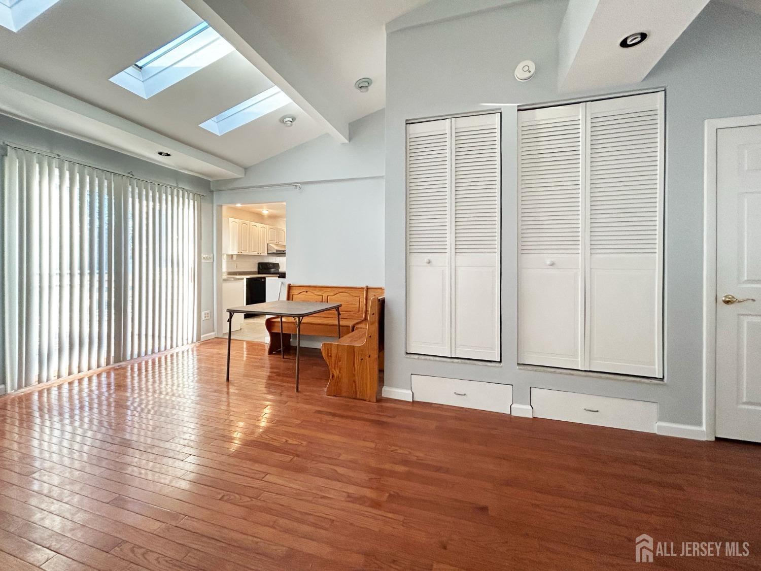 122 Vineyard Road Edison, NJ 08817 - Photo 11 of 19 a view of empty room with wooden floor and fireplace