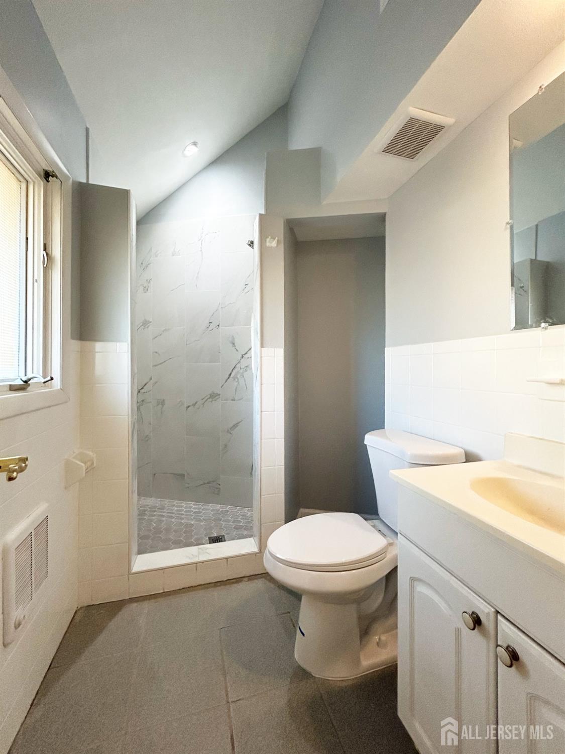 122 Vineyard Road Edison, NJ 08817 - Photo 13 of 19 a bathroom with a sink a toilet and shower