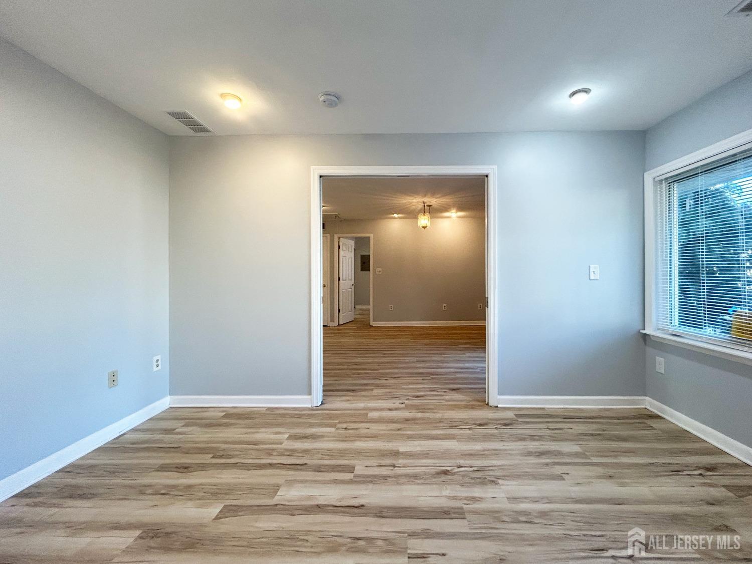 122 Vineyard Road Edison, NJ 08817 - Photo 16 of 19 a view of a room with wooden floor