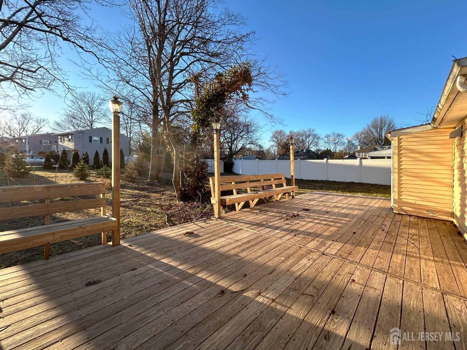 122 Vineyard Road Edison, NJ 08817 - Photo 4 of 19 a view of a swimming pool with a patio