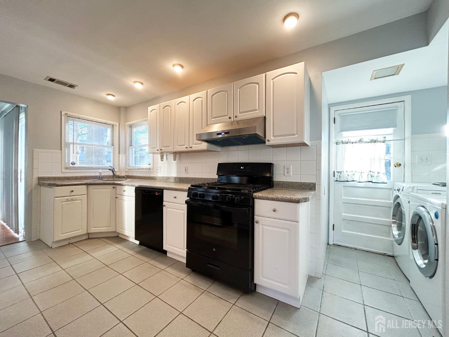 122 Vineyard Road Edison, NJ 08817 - Photo 8 of 19 a kitchen with stainless steel appliances granite countertop a sink and cabinets