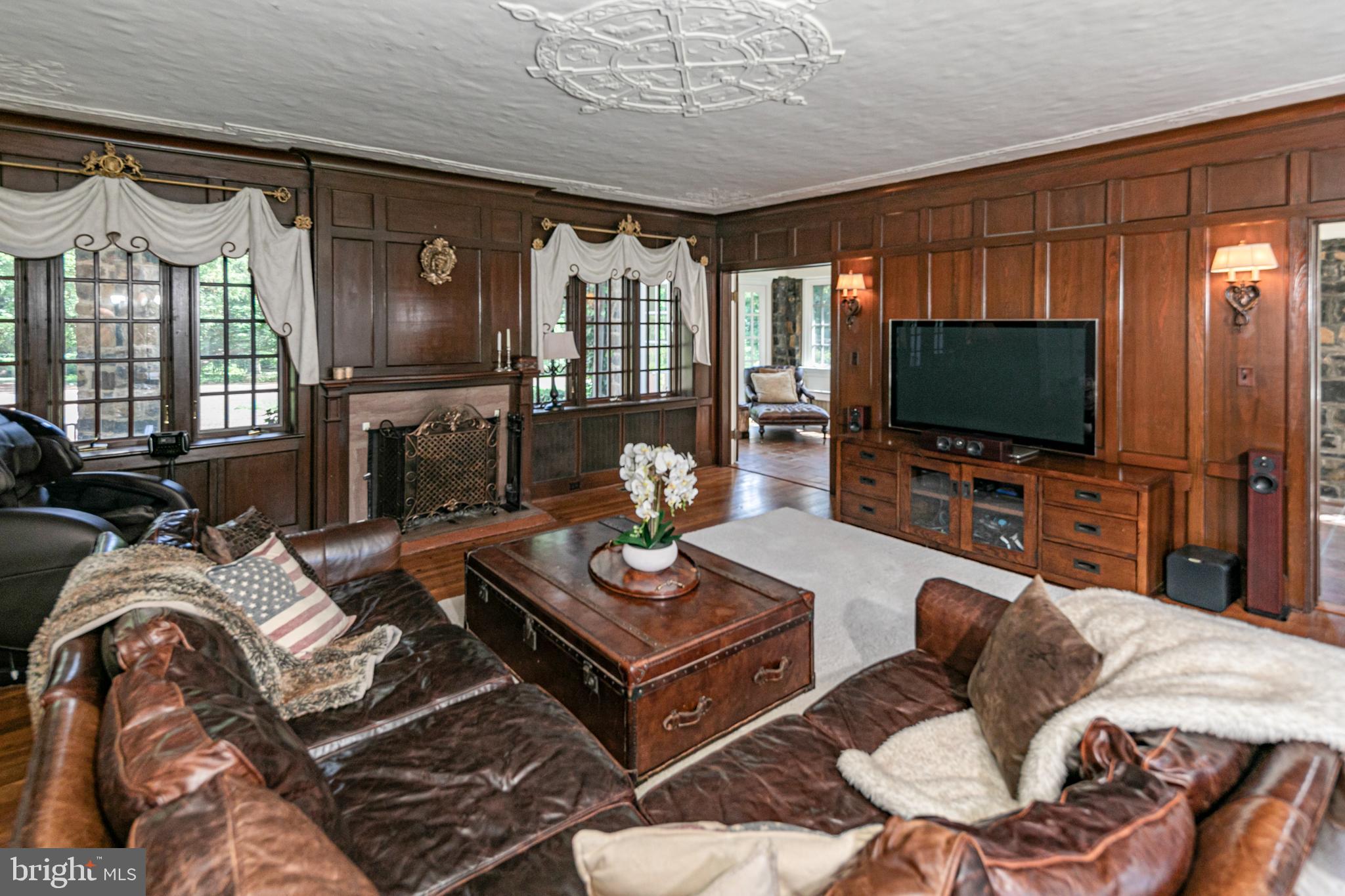 99 Ridgeview Road Princeton, NJ 08540 - Photo 7 of 45 a living room with furniture a flat screen tv and a large window