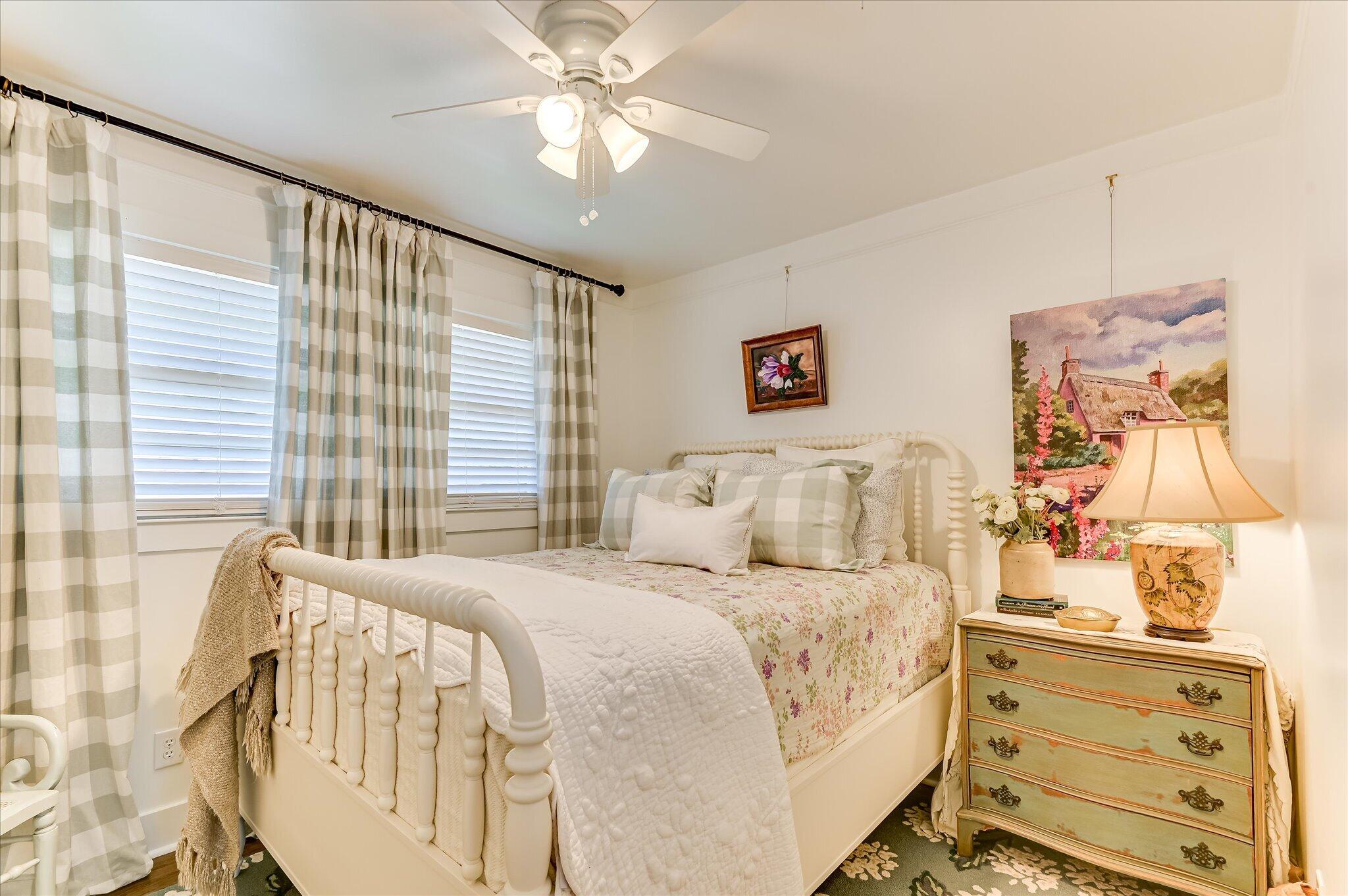 1121 Ridgecrest Avenue North Augusta, SC 29841 - Photo 30 of 42 a bedroom with a bed and a chandelier
