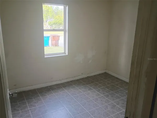 a view of a room that has a window in it