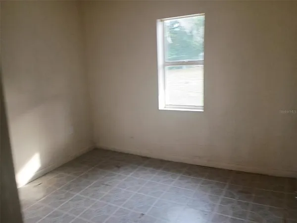 an empty room with a window