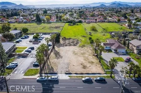 an aerial view of residential houses with outdoor space and swimming pool