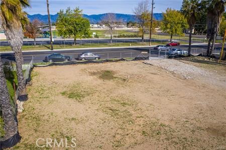 405 West Merrill Avenue Rialto, CA 92376 - Photo 3 of 20 a view of a swimming pool with a yard and trees