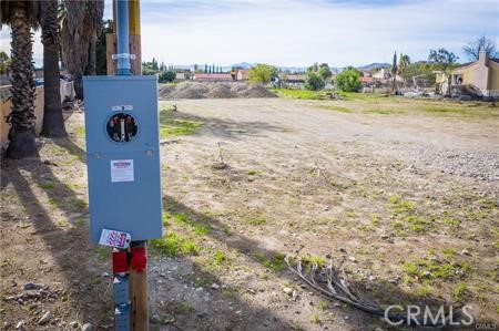 405 West Merrill Avenue Rialto, CA 92376 - Photo 7 of 20 a street sign on the side of the road