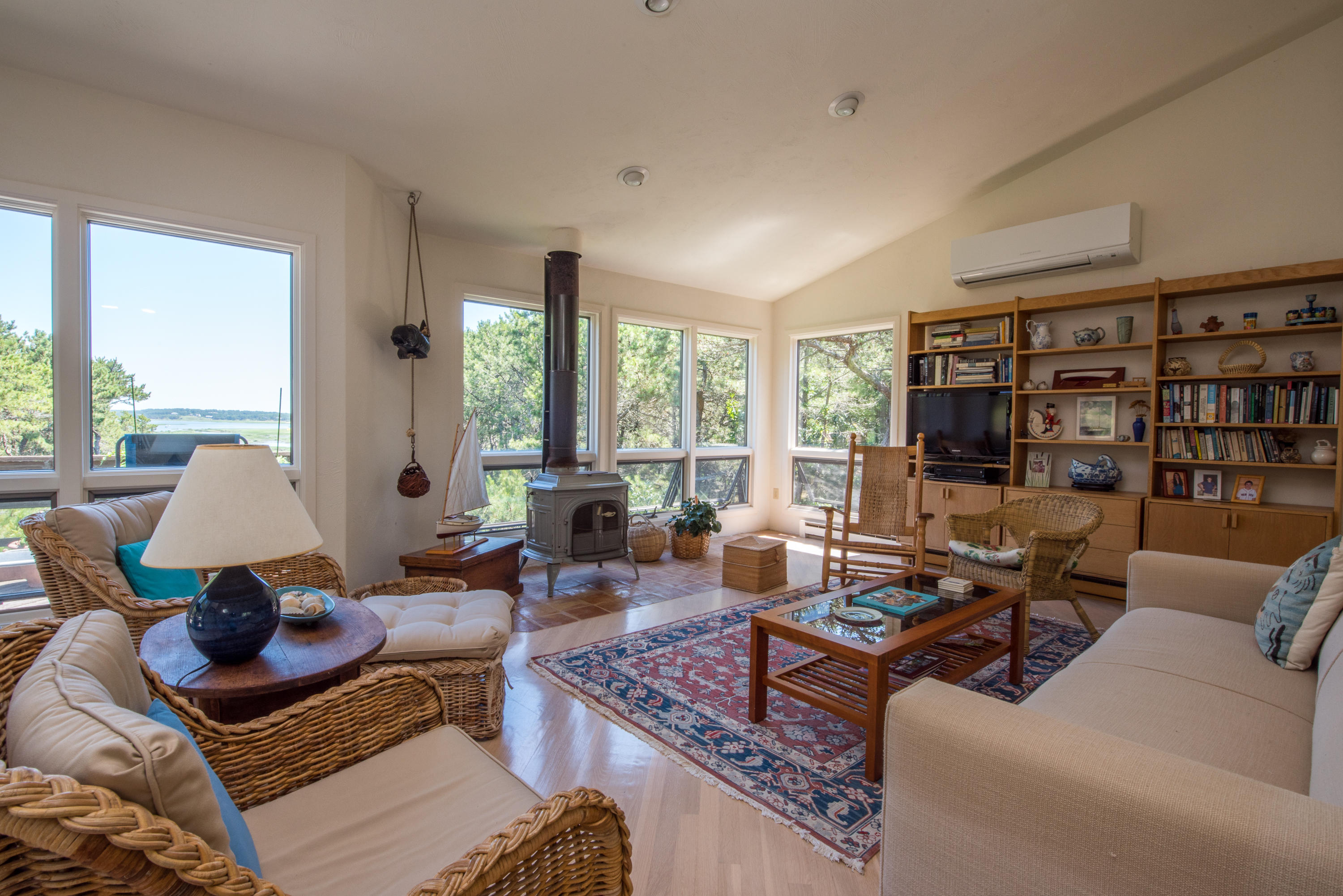 245 King Phillip Road Wellfleet, MA 02667 - Photo 11 of 33 a living room with furniture and large windows