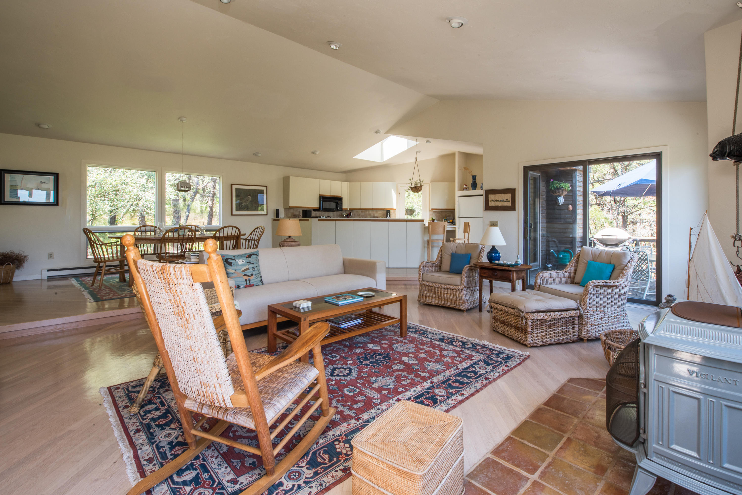 245 King Phillip Road Wellfleet, MA 02667 - Photo 12 of 33 a living room with furniture a rug and a table