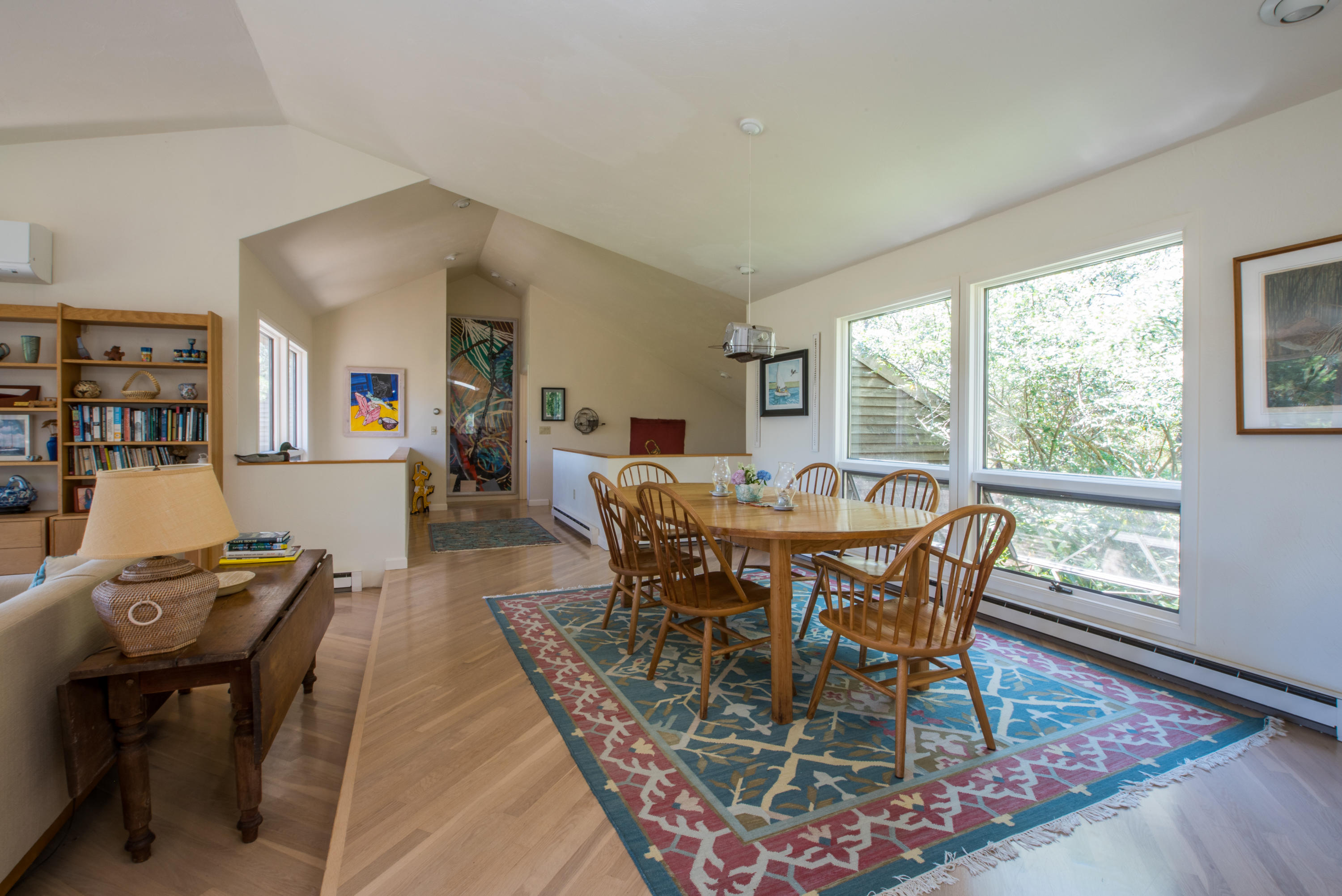 245 King Phillip Road Wellfleet, MA 02667 - Photo 14 of 33 a view of a dining room with furniture and wooden floor
