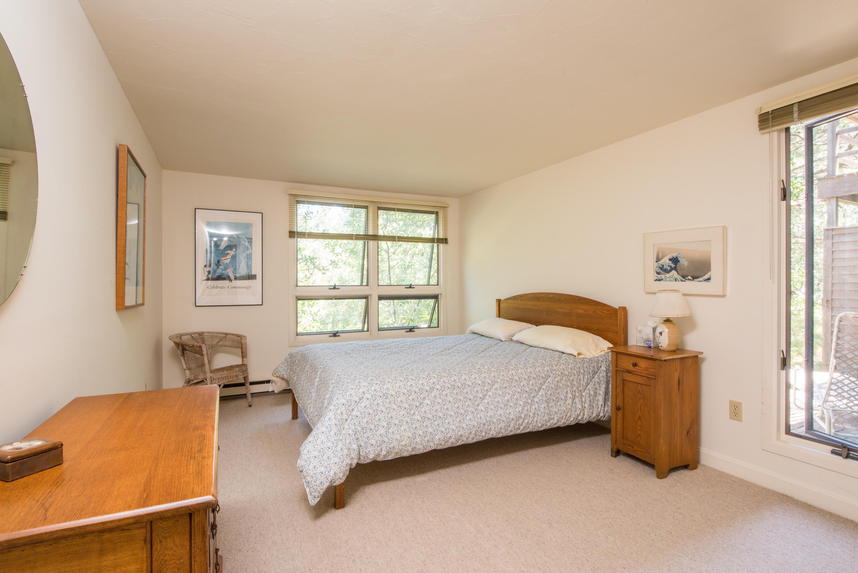 245 King Phillip Road Wellfleet, MA 02667 - Photo 19 of 33 a bedroom with a bed and wooden floor