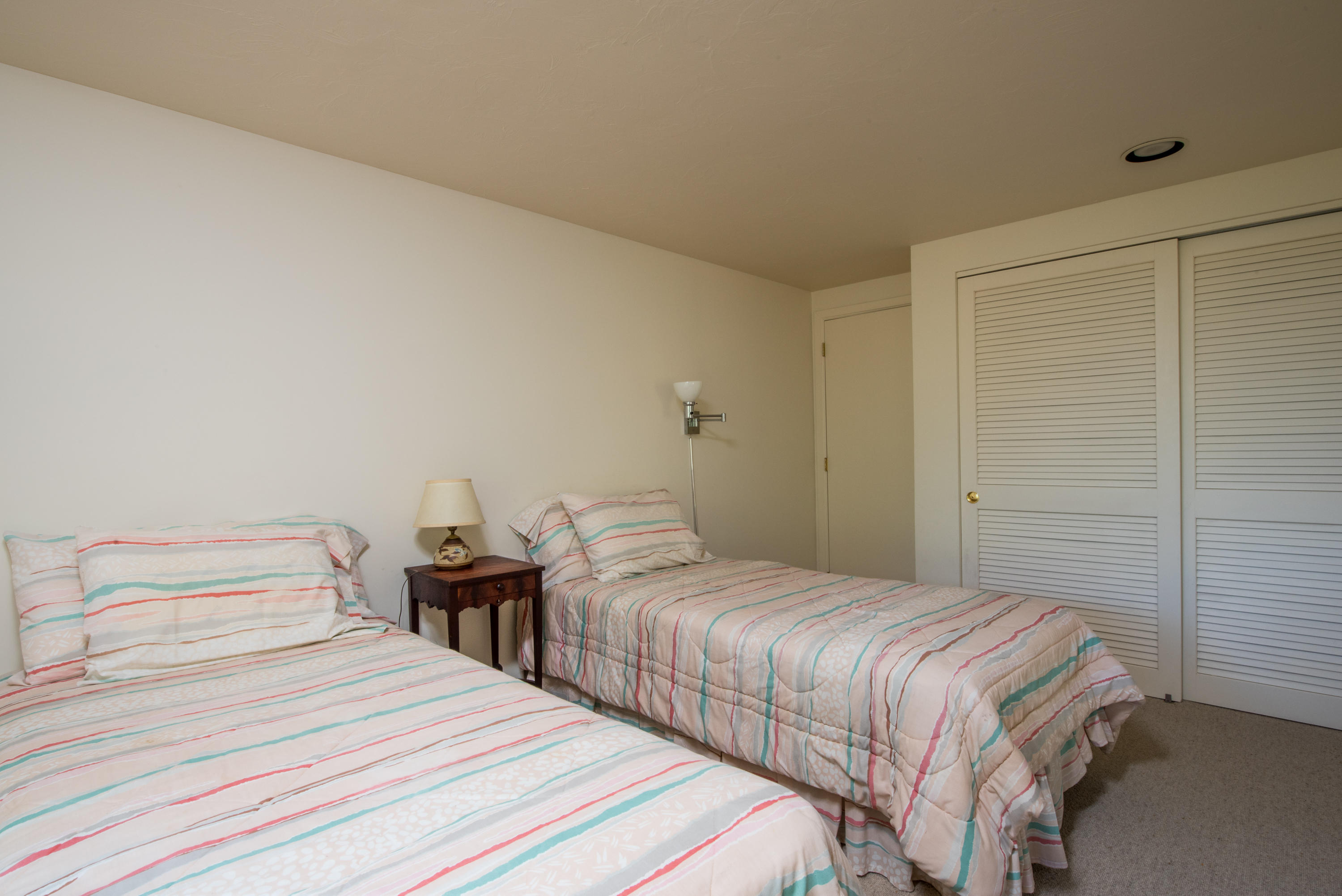 245 King Phillip Road Wellfleet, MA 02667 - Photo 22 of 33 a bedroom with two beds and a closet
