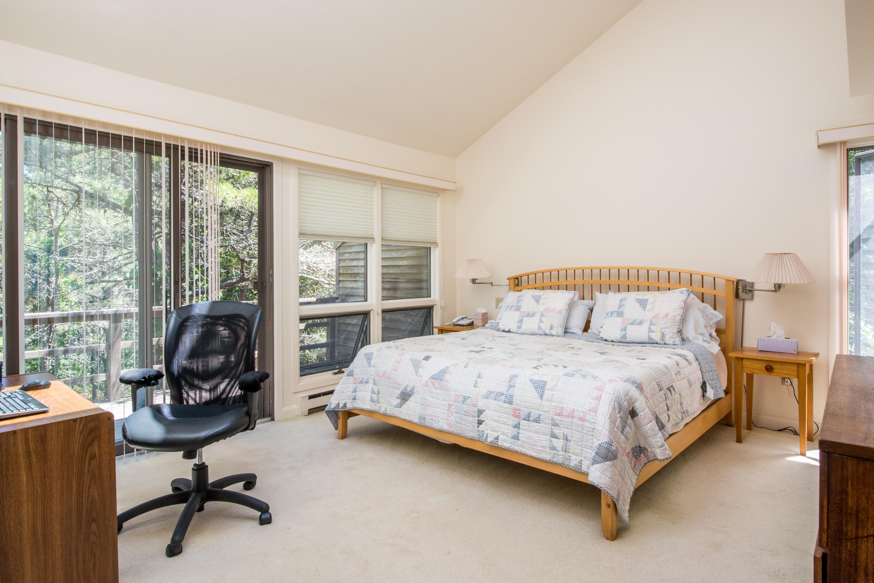 245 King Phillip Road Wellfleet, MA 02667 - Photo 25 of 33 a bedroom with a bed chair and a large window