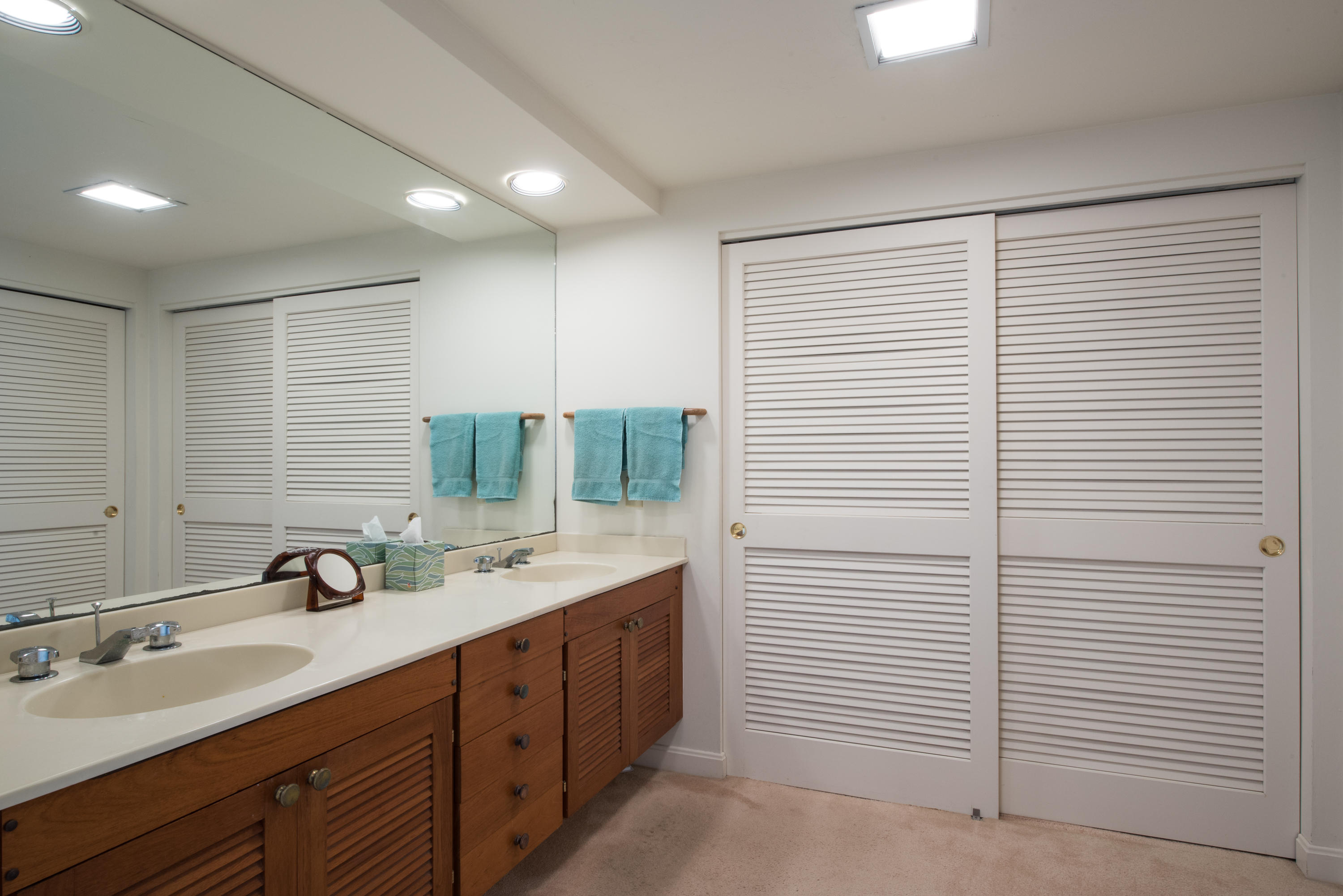 245 King Phillip Road Wellfleet, MA 02667 - Photo 27 of 33 a bathroom with a double vanity sink and a mirror