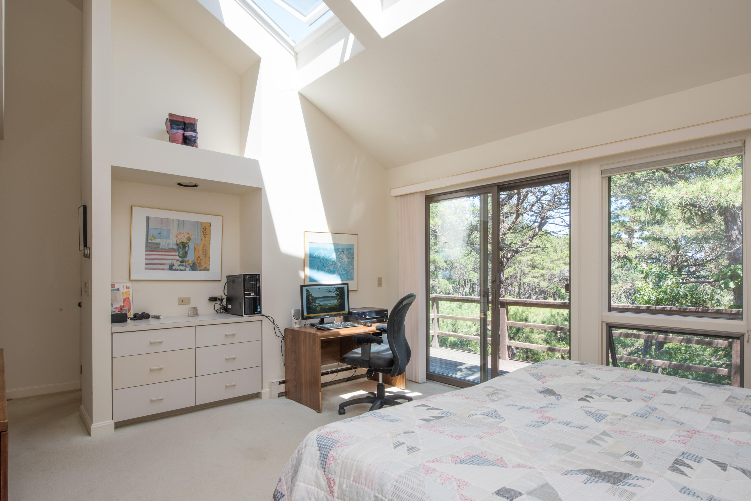 245 King Phillip Road Wellfleet, MA 02667 - Photo 28 of 33 a bedroom with a bed and a large window