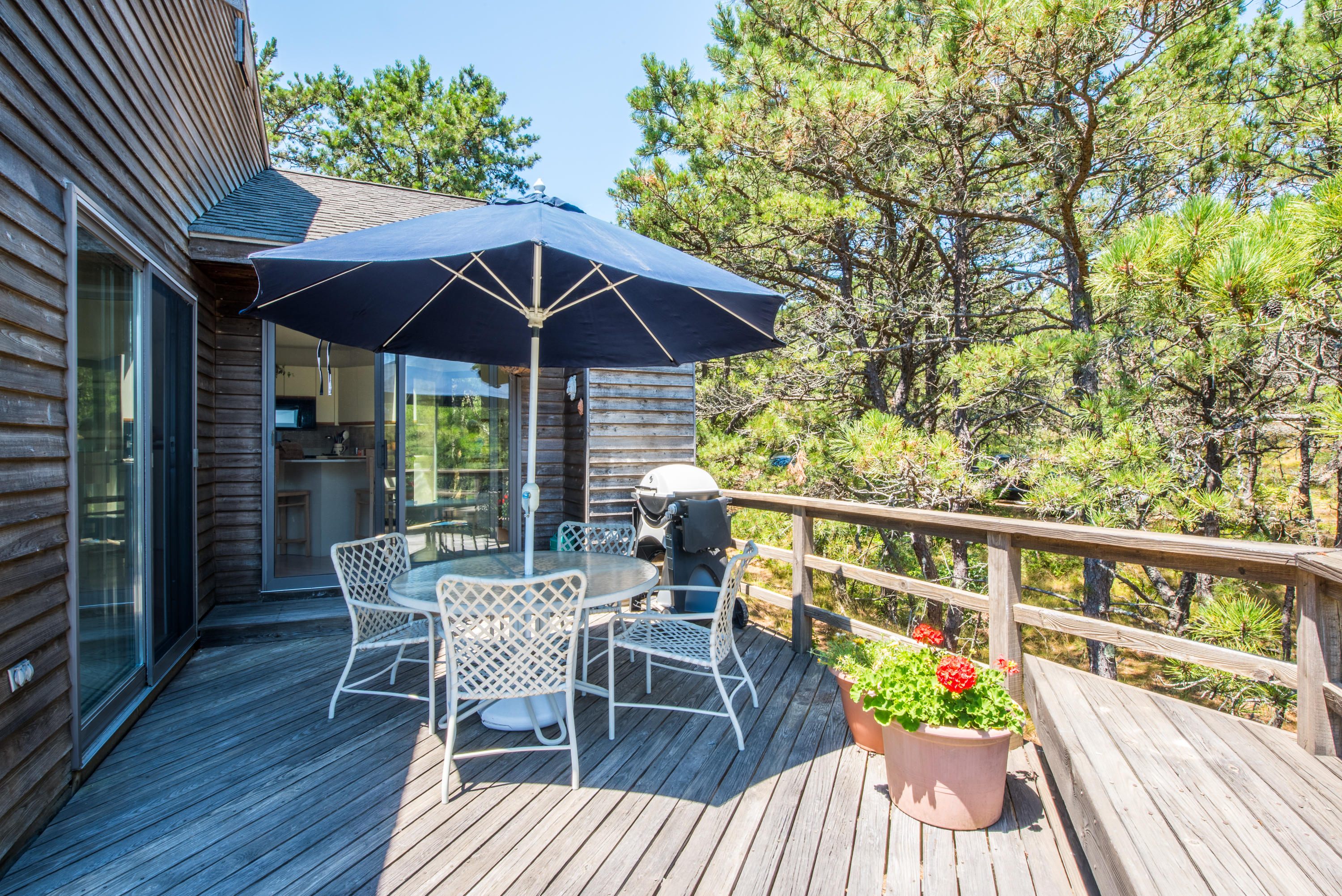 245 King Phillip Road Wellfleet, MA 02667 - Photo 31 of 33 a view of balcony with furniture and umbrella