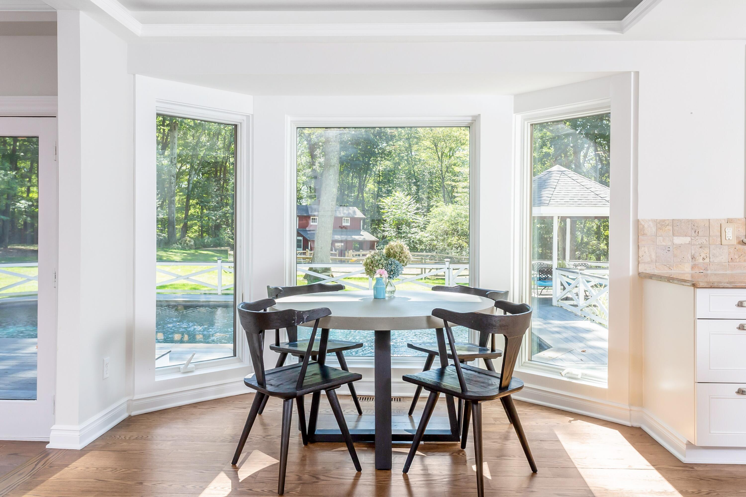30 Carrington Drive Greenwich, CT 06831 - Photo 13 of 46 a view of a dining room with furniture window and outside view