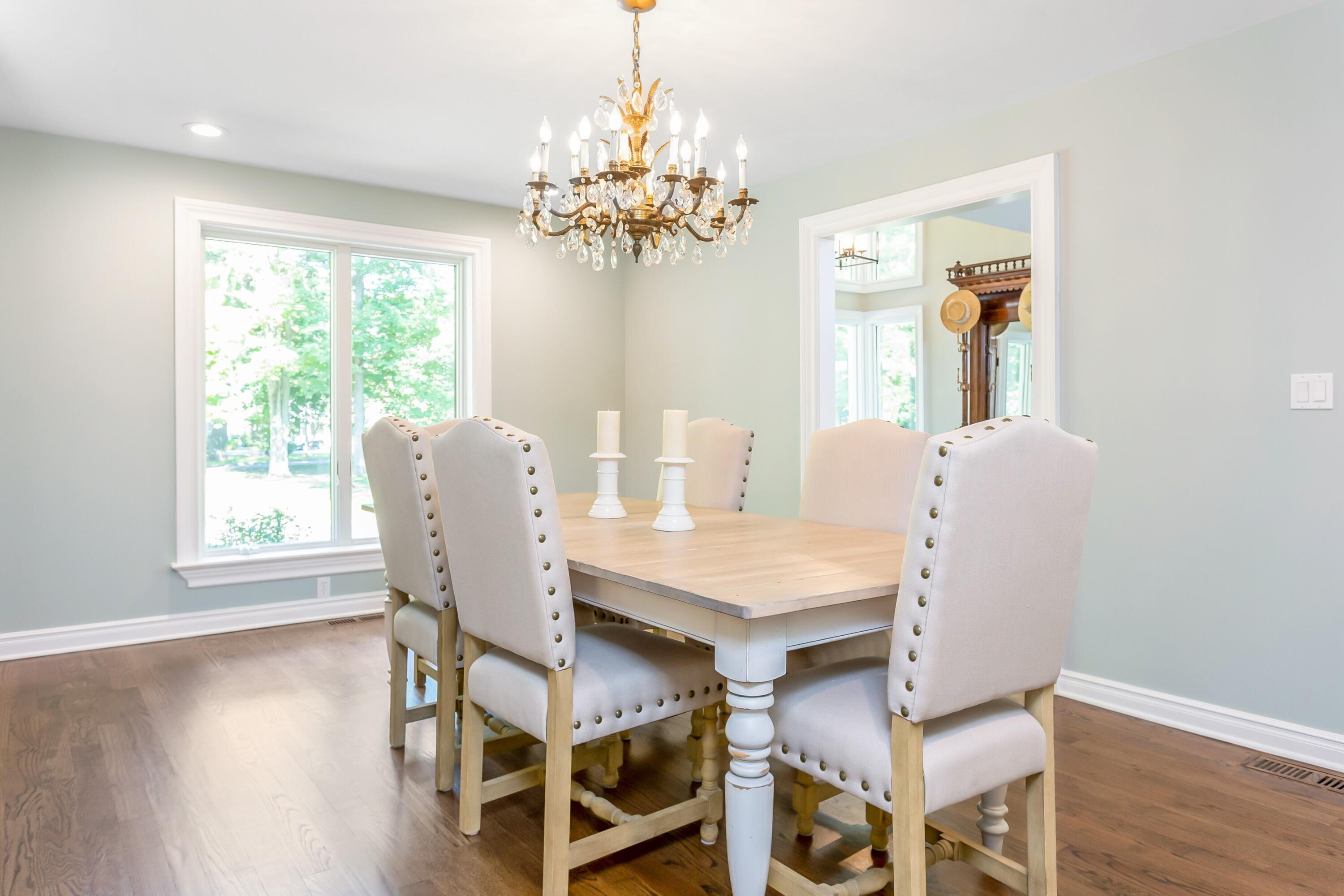30 Carrington Drive Greenwich, CT 06831 - Photo 16 of 46 a view of a dining room with furniture a chandelier and wooden floor