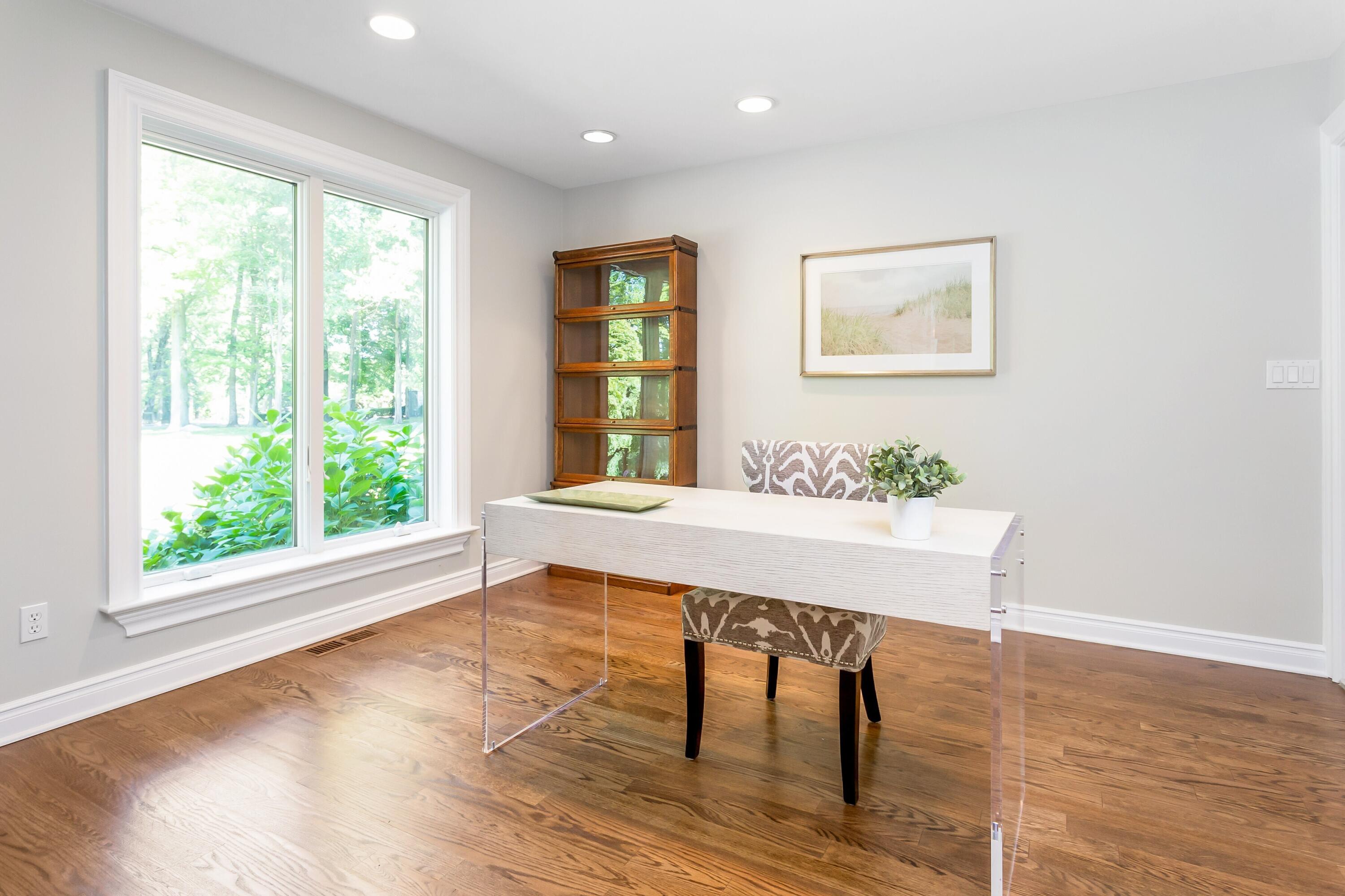 30 Carrington Drive Greenwich, CT 06831 - Photo 18 of 46 a view of a work space with wooden floor and a potted plant