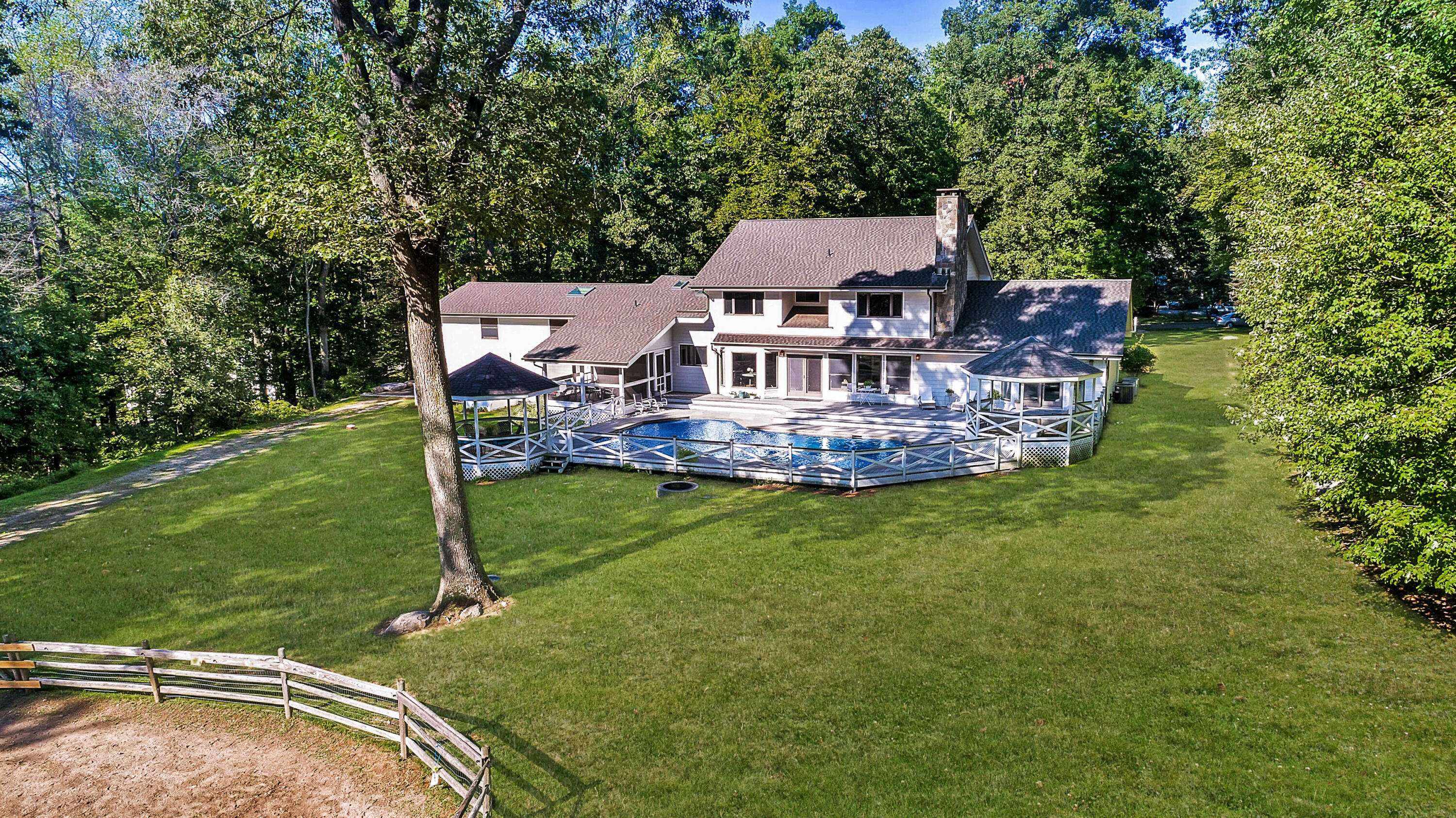 30 Carrington Drive Greenwich, CT 06831 - Photo 3 of 46 an aerial view of a house with a garden